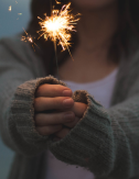 Woman holds sparkler