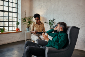 a therapist talks with a client during Cognitive-behavioral therapy